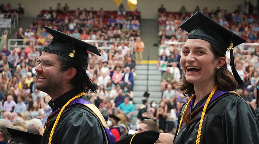 students at graduation wearing their caps and gowns